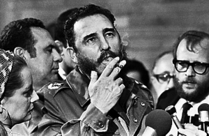 Then Cuban Prime Minister Fidel Castro smokes a cigar during interviews with the press during a visit of U S Senator Charles McGovern in Havana in this May 1975 file photo REUTERS Prensa Latina File Photo